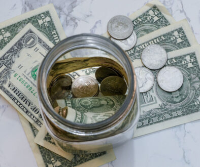 Lookind down in a jar with money